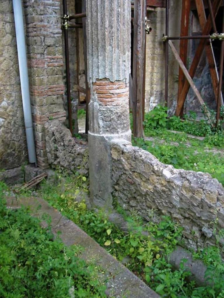 V.15, Herculaneum. May 2003. Looking towards north-west corner of garden area.
Photo courtesy of Nicolas Monteix.
According to Jashemski, the garden (9.90 x 4.90m) at the rear of the tablinum was enclosed by a windowed passageway on the west side.
A portico, supported by seven columns connected with a low wall, was on the north and east.
There was a wide water channel on three edges of the garden, and in the middle of the garden was a well with a heavy masonry puteal.
The mouth of the puteal was a large neck of a dolium.
See Jashemski, W. F., 1993. The Gardens of Pompeii, Volume II: Appendices. New York: Caratzas. (p.269).
See also Maiuri, A. (1958). Ercolano, I Nuovi Scavi (1927-1958), vol.1. (p.233).